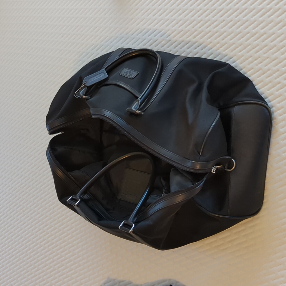 Black canvas and leather Coach weekender, travel bag